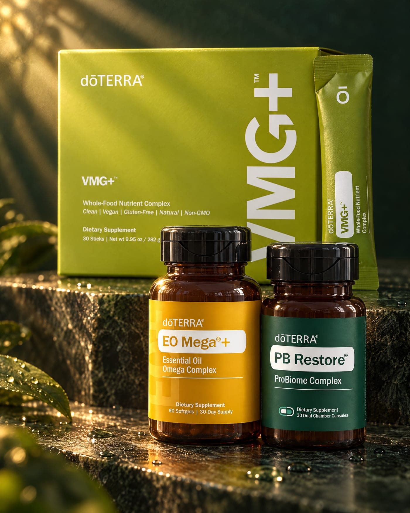 The VMG+ box, EO Mega+ and PB Restore bottles on dark green stone in a beam of morning light